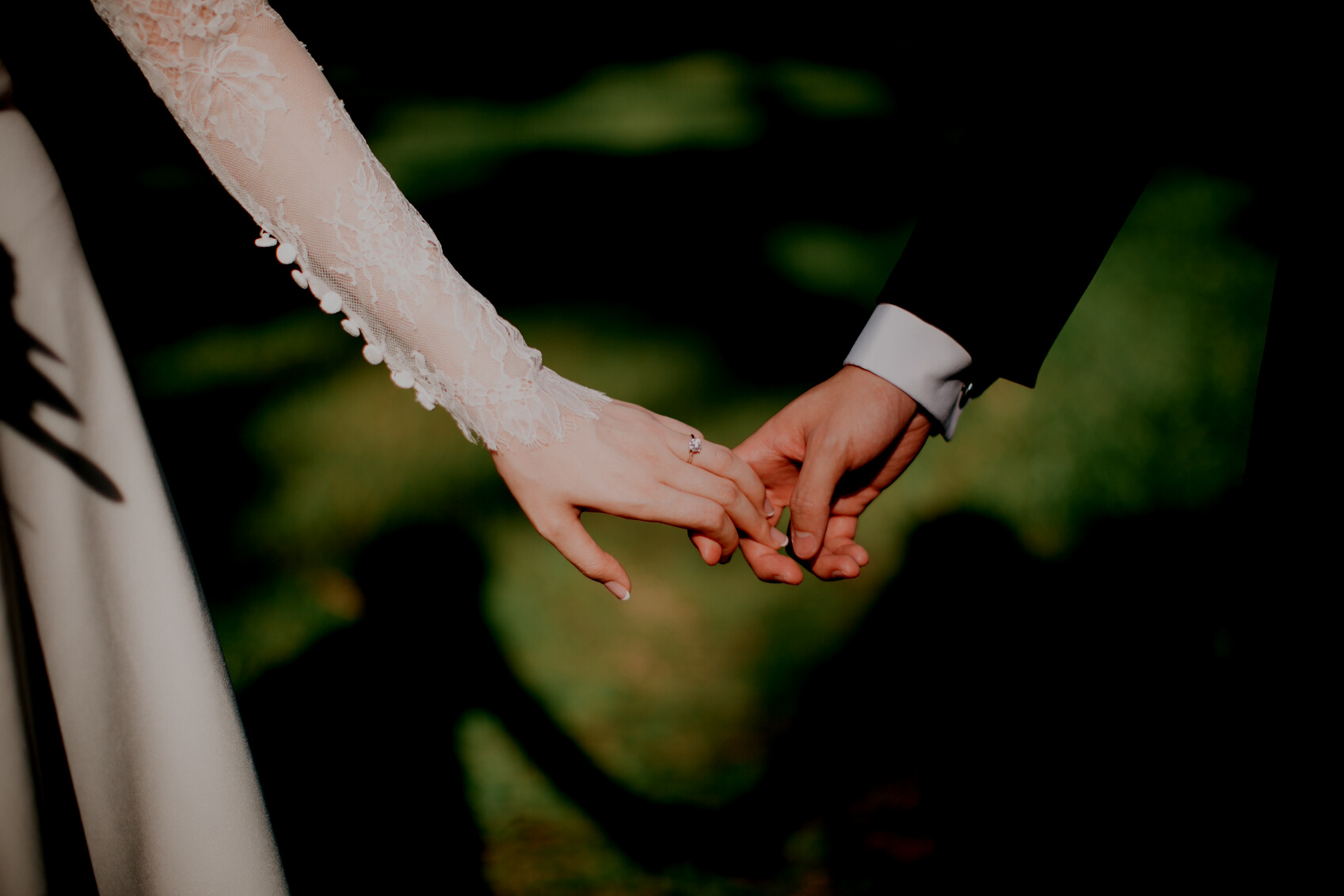 Bride and Groom Holding Hands